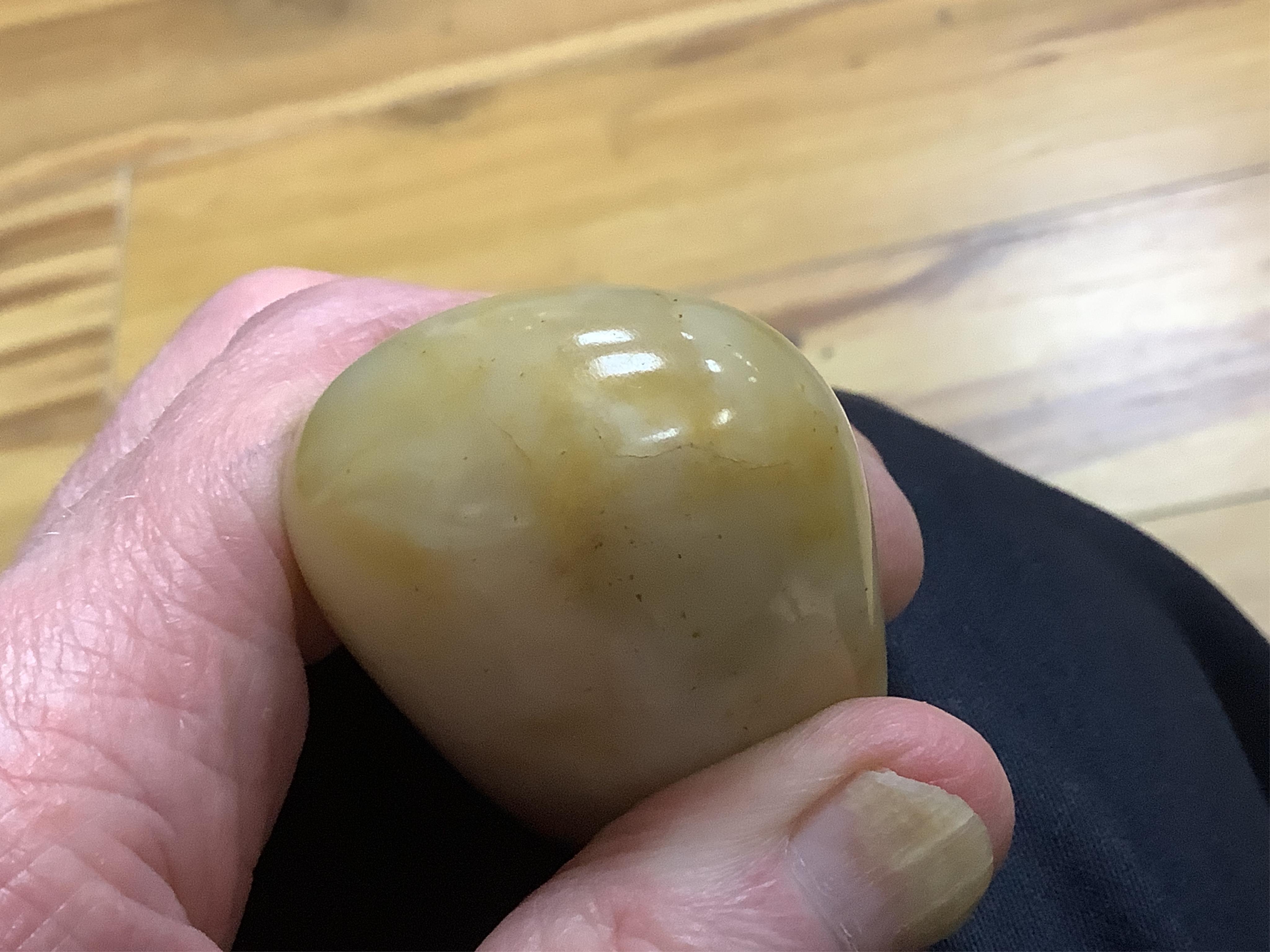 A 19th century Chinese white and russet jade pebble snuff bottle, 5.5cm in length